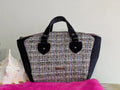 Fixation Fibre and Function structured handbag featuring multi-colored tweed, black velvet sides, and velvet handles.