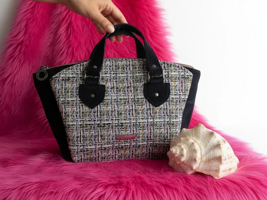 Fixation Fibre and Function structured handbag with multi-colored tweed and black velvet panels on pink faux fur